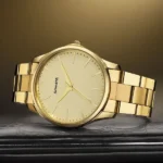 Sonata Traditional Essentials Quartz Analog Champagne Dial Golden Metal Strap Watch For Men